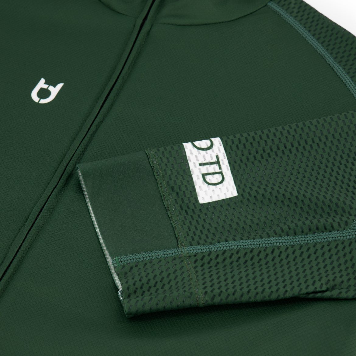 Mesh sleeves detail photo of a dark green racing bike shirt for the summer