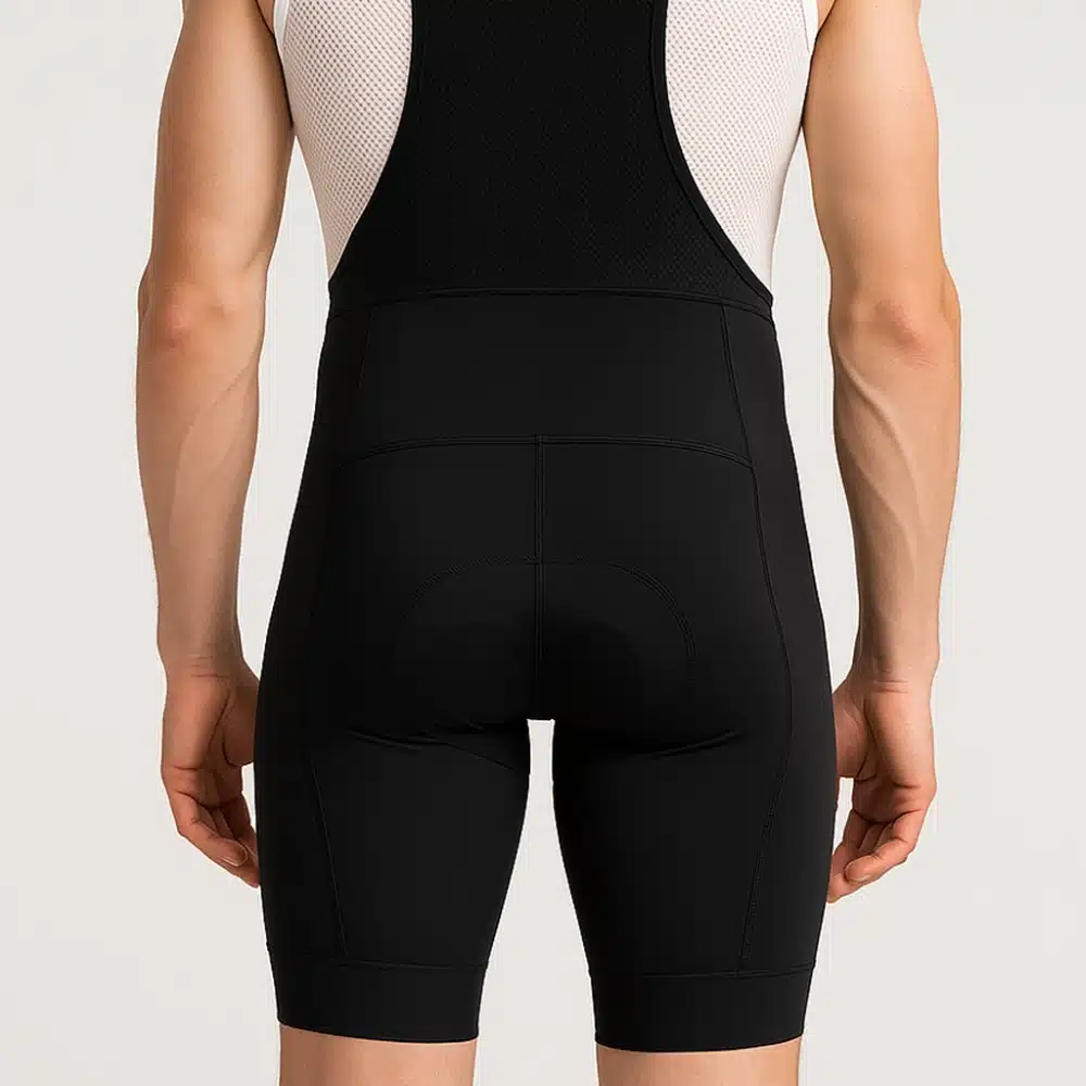 Male model rear view in Pro 300 kit showing pocket structure and strap placement.